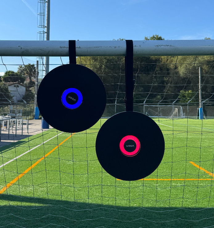 Two players training with the Voon Soccer smart rebounders and having fun.