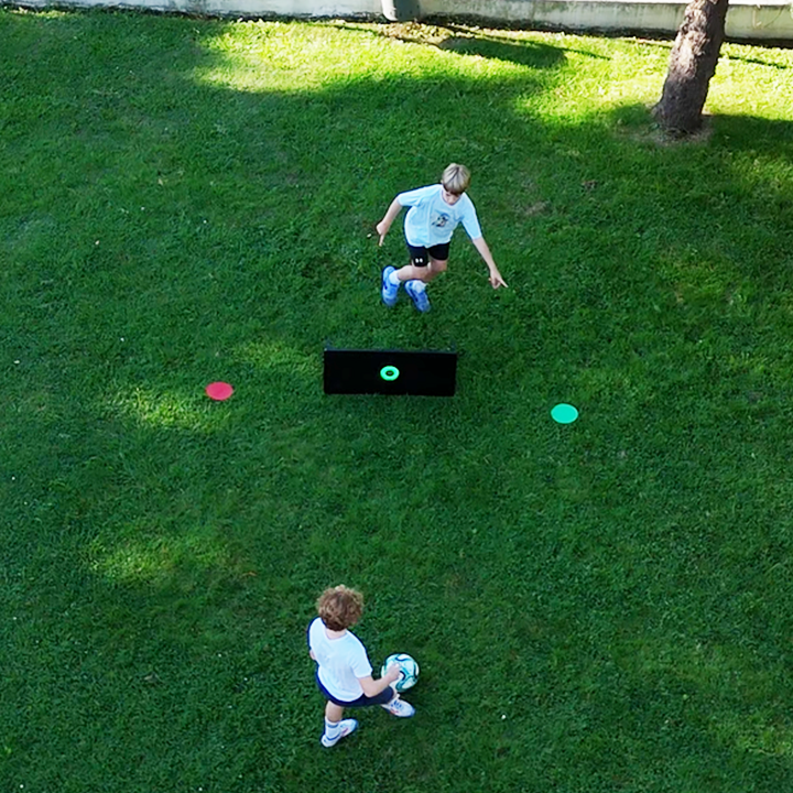 Two players training with the Voon Soccer smart rebounders and having fun.